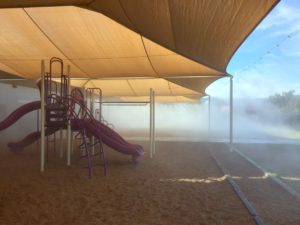 Shaded playground with mist